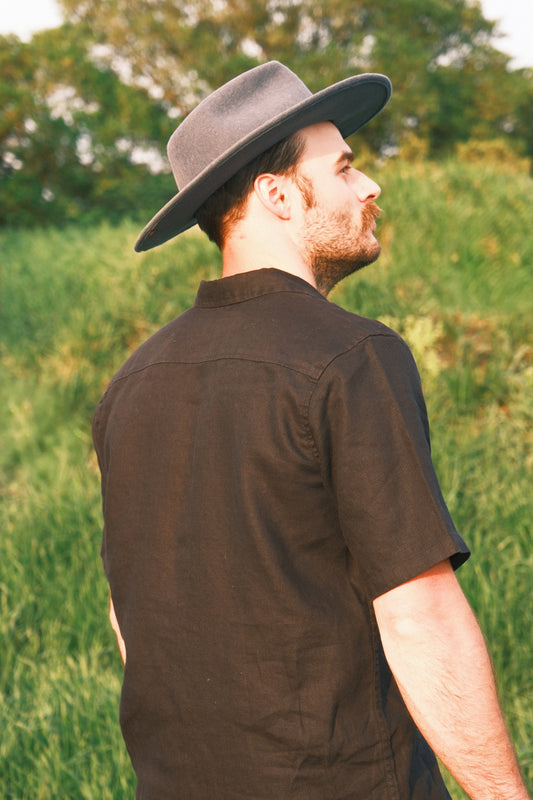 Model wearing Utku Camp Linen Shirt in Black — 100% linen