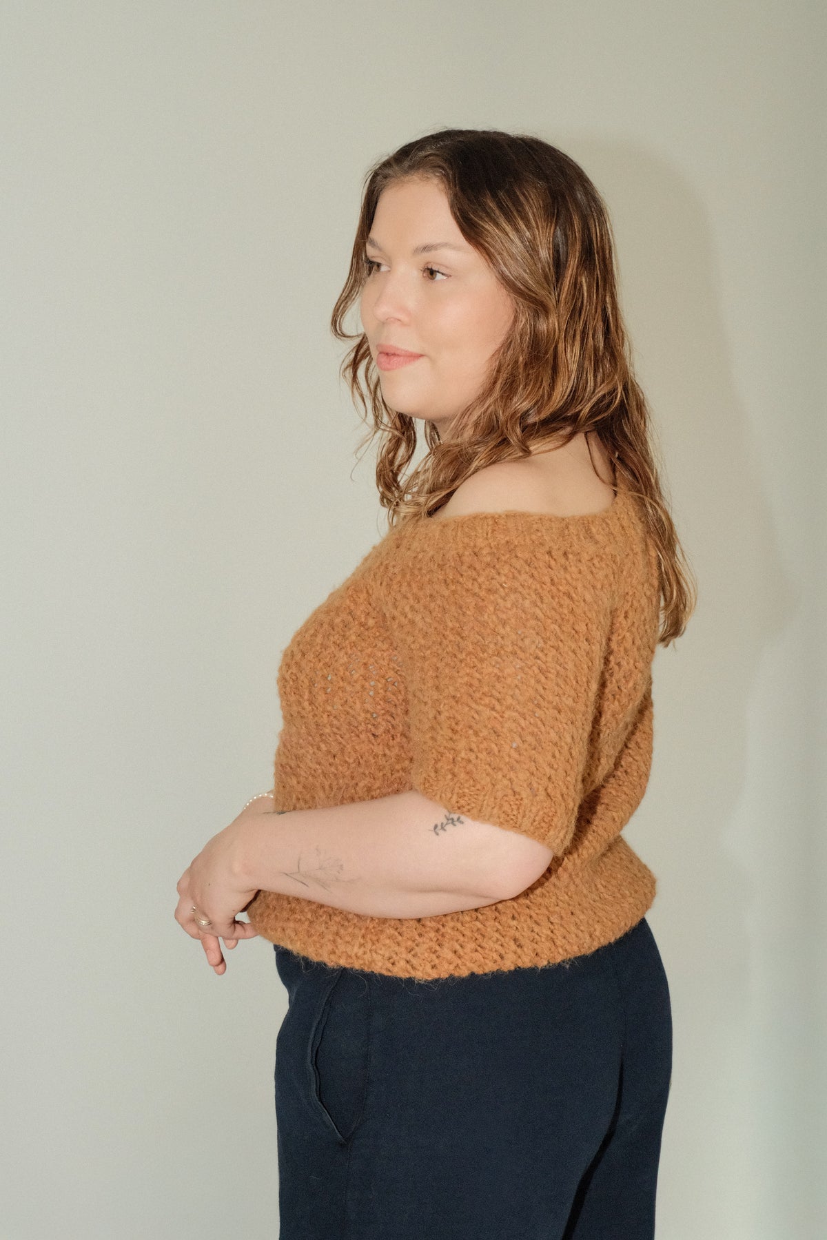 Model wearing Utku Off-Shoulder Alpaca Top in Bronze — handmade in Ecuador
