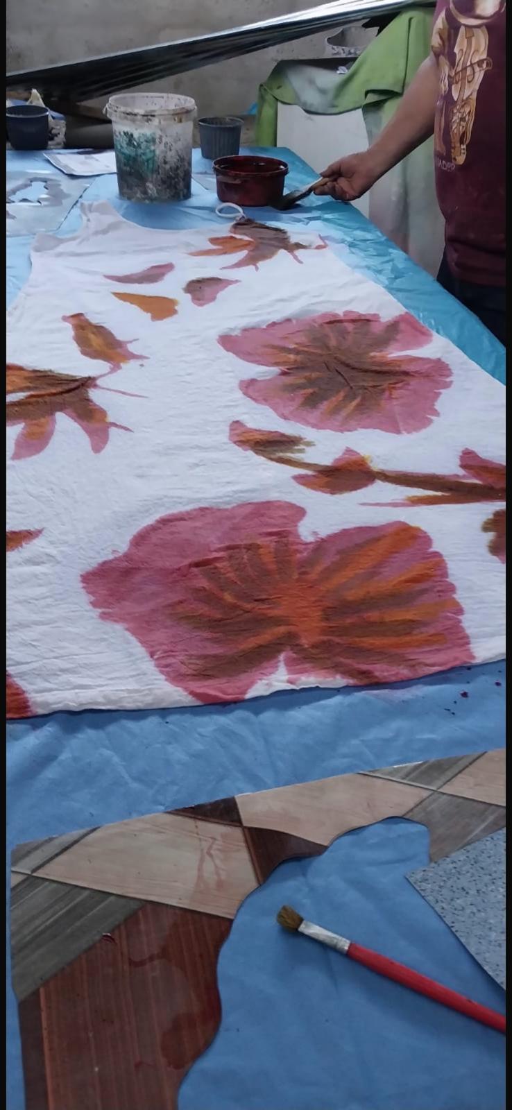 Finished hand-painted floral detail on UTKU dress fabric