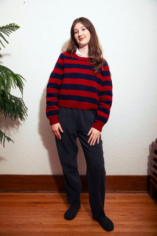 model wearing red navy striped wool crewneck utku