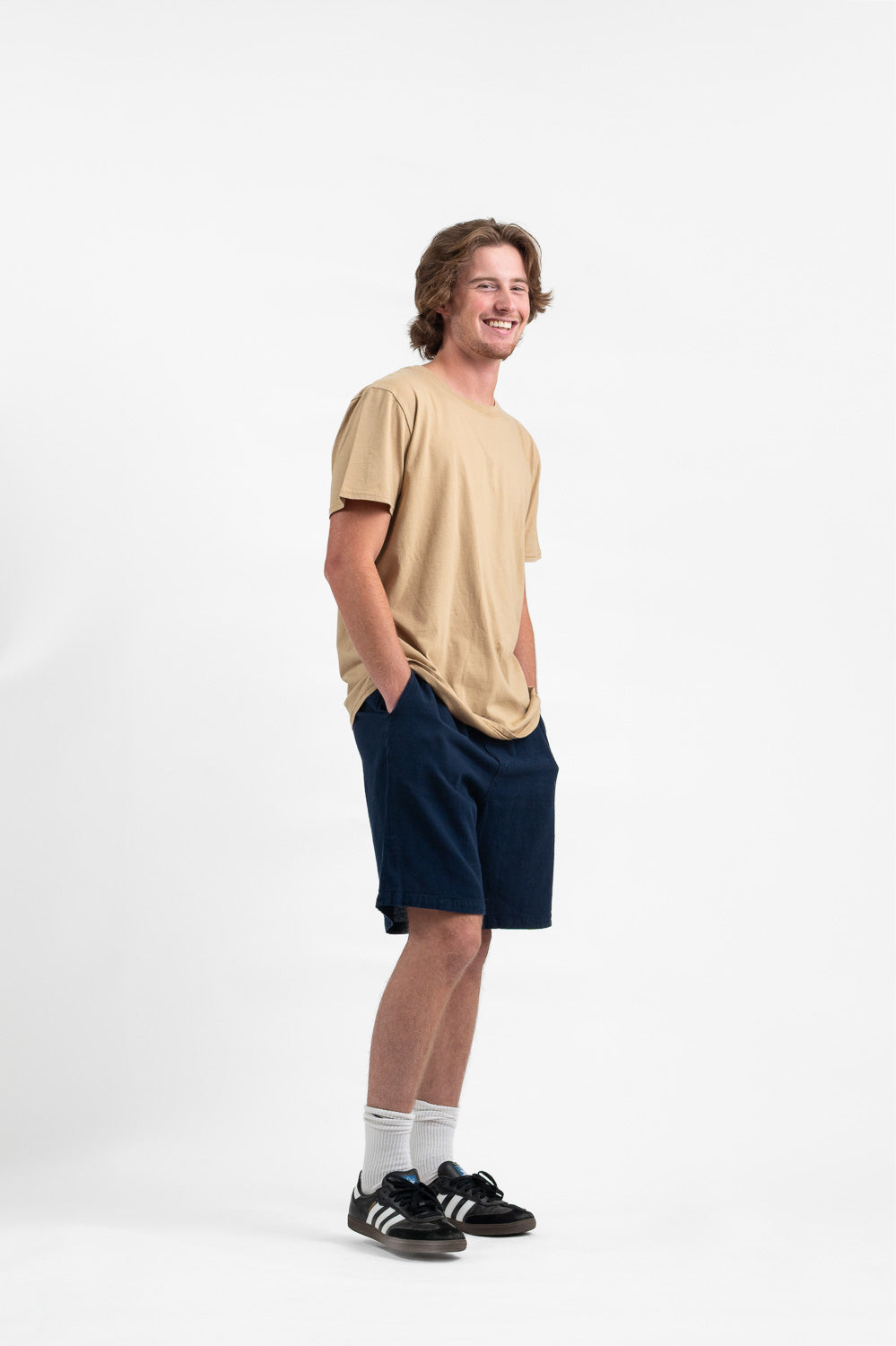 Model wearing Utku Classic Tee in Ivory Buff