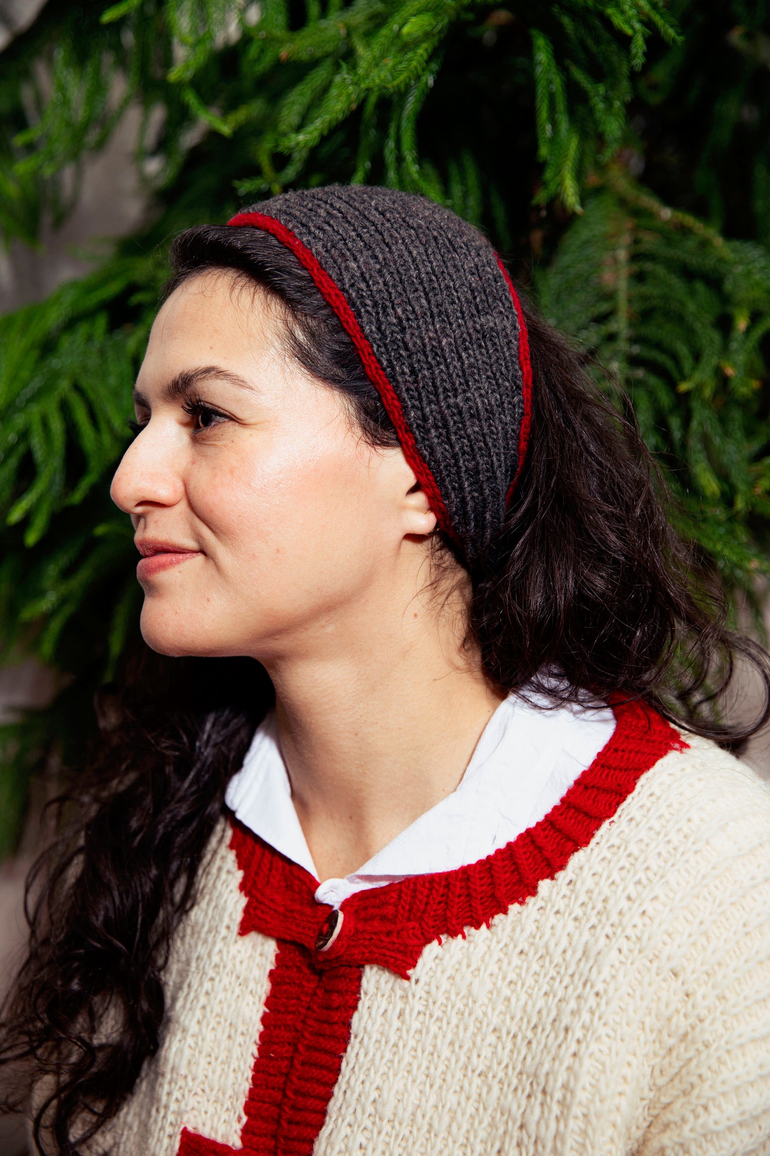 Model wearing Utku Knit Headband in Deep charcoal — hand knitted in Ecuador