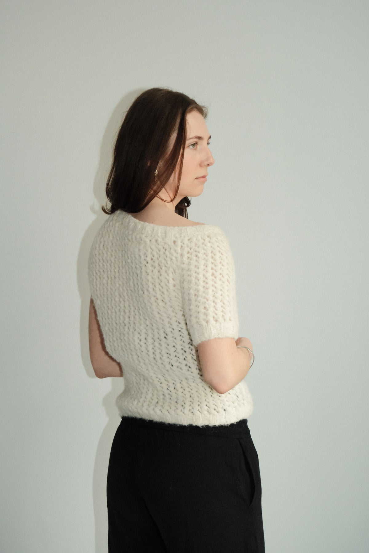 Model wearing Utku Off-Shoulder Alpaca Top in Gardenia — soft alpaca fiber