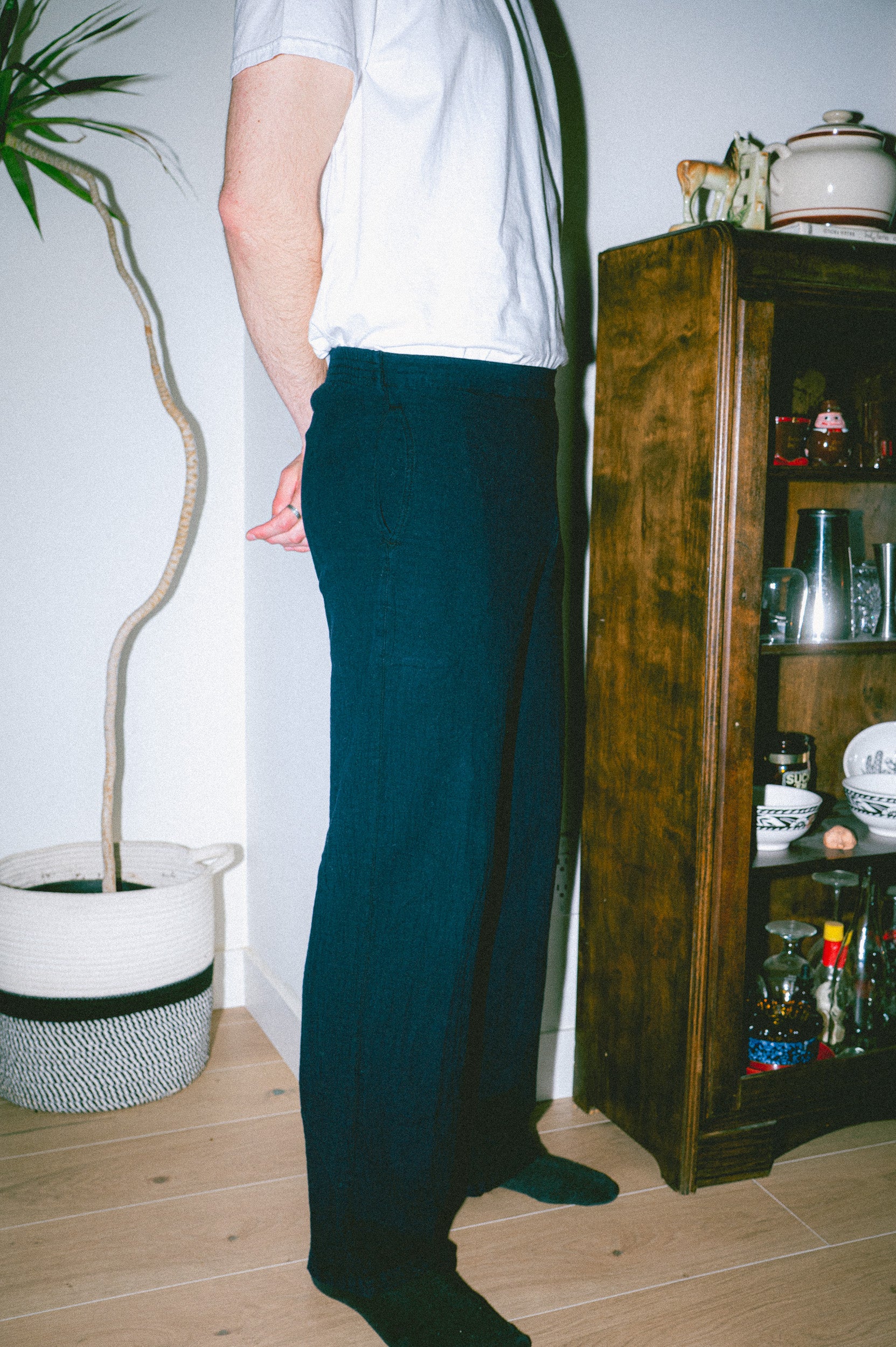 Model wearing Utku Straight Pants in Lyon blue