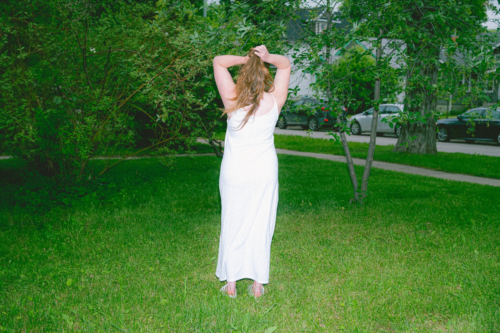 Model wearing Utku Camisole Dress in True white — handmade in Ecuador