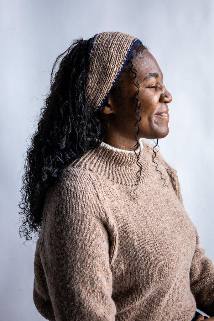 Model wearing Utku Knit Headband in Tobacco Brown — hand knitted in Ecuador