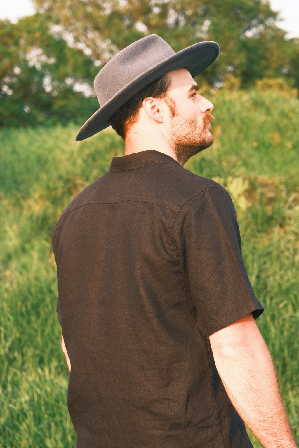 Model wearing Utku Camp Linen Shirt in Black — 100% linen