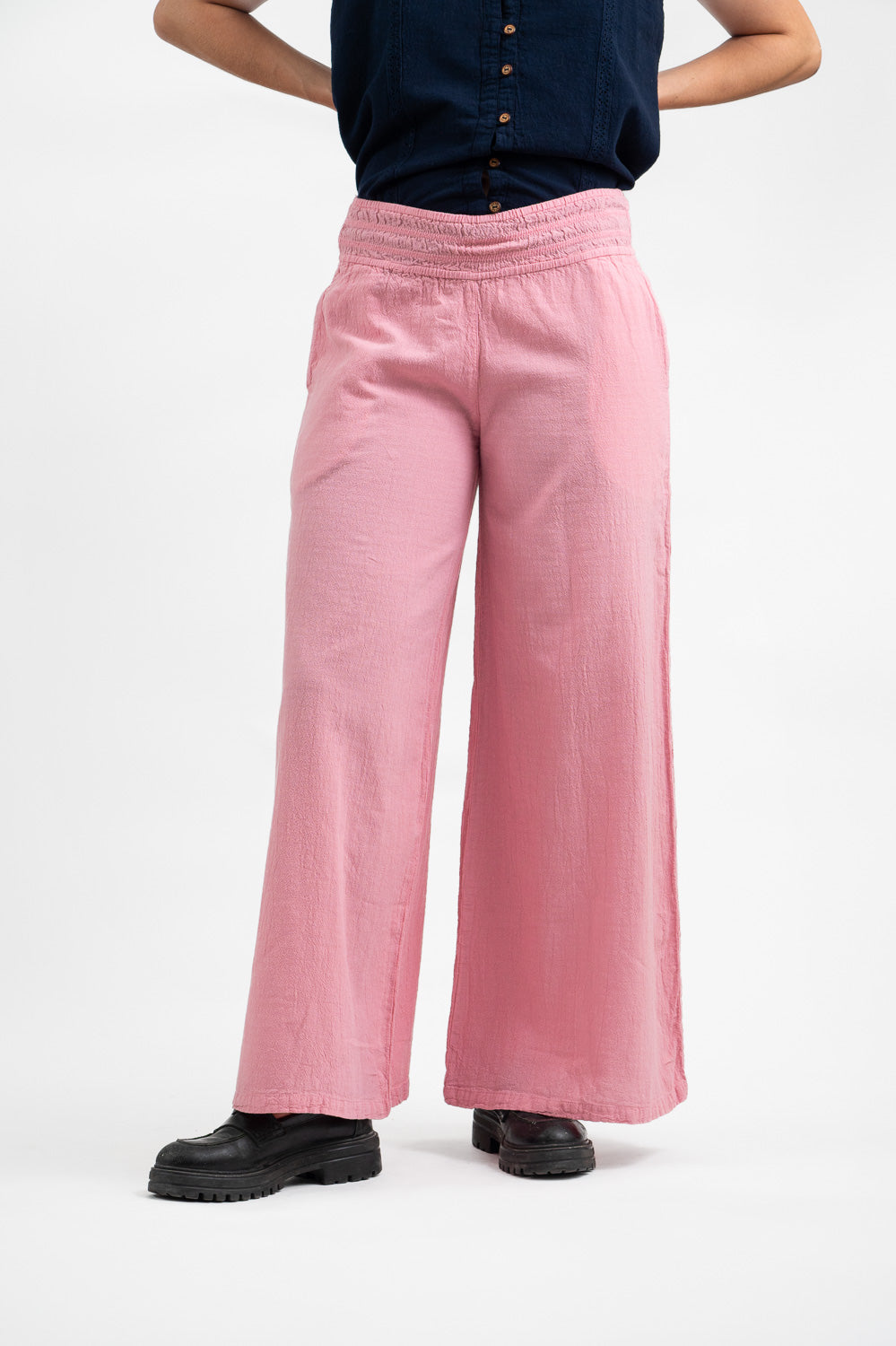 Model wearing Utku Wide Leg Pants in Corinthian pink — handmade in Ecuador