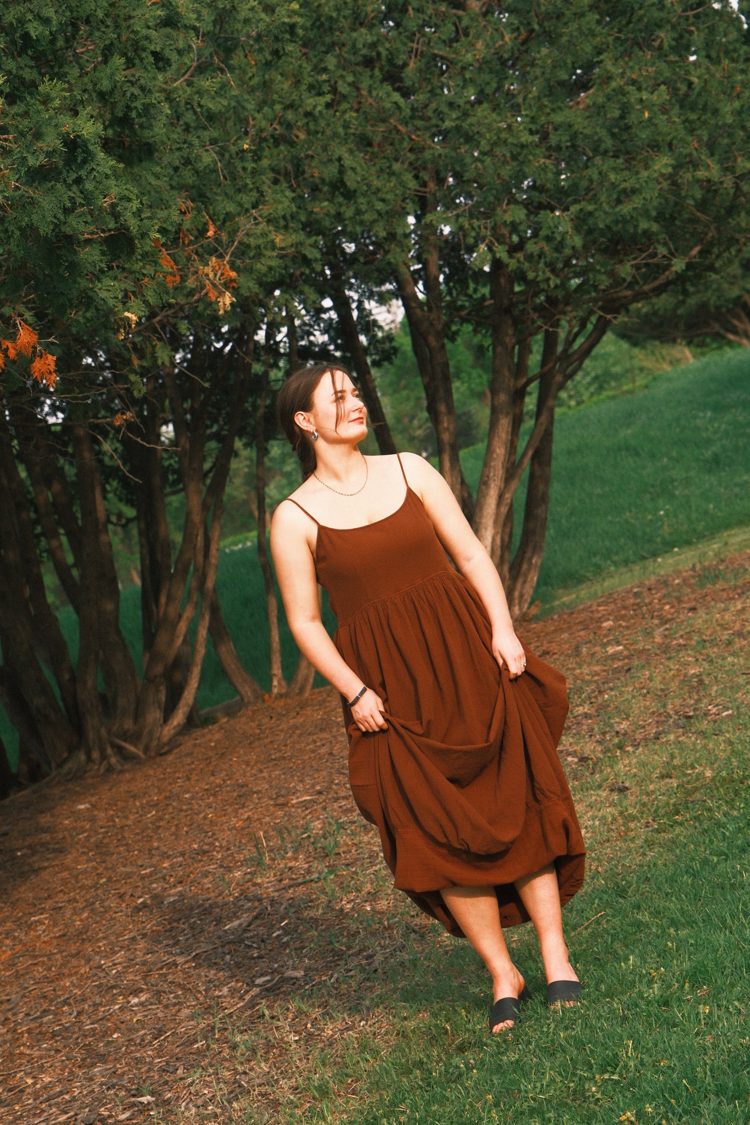 Utku Barrel Dress in Espresso — woman wearing barrel dress at the park