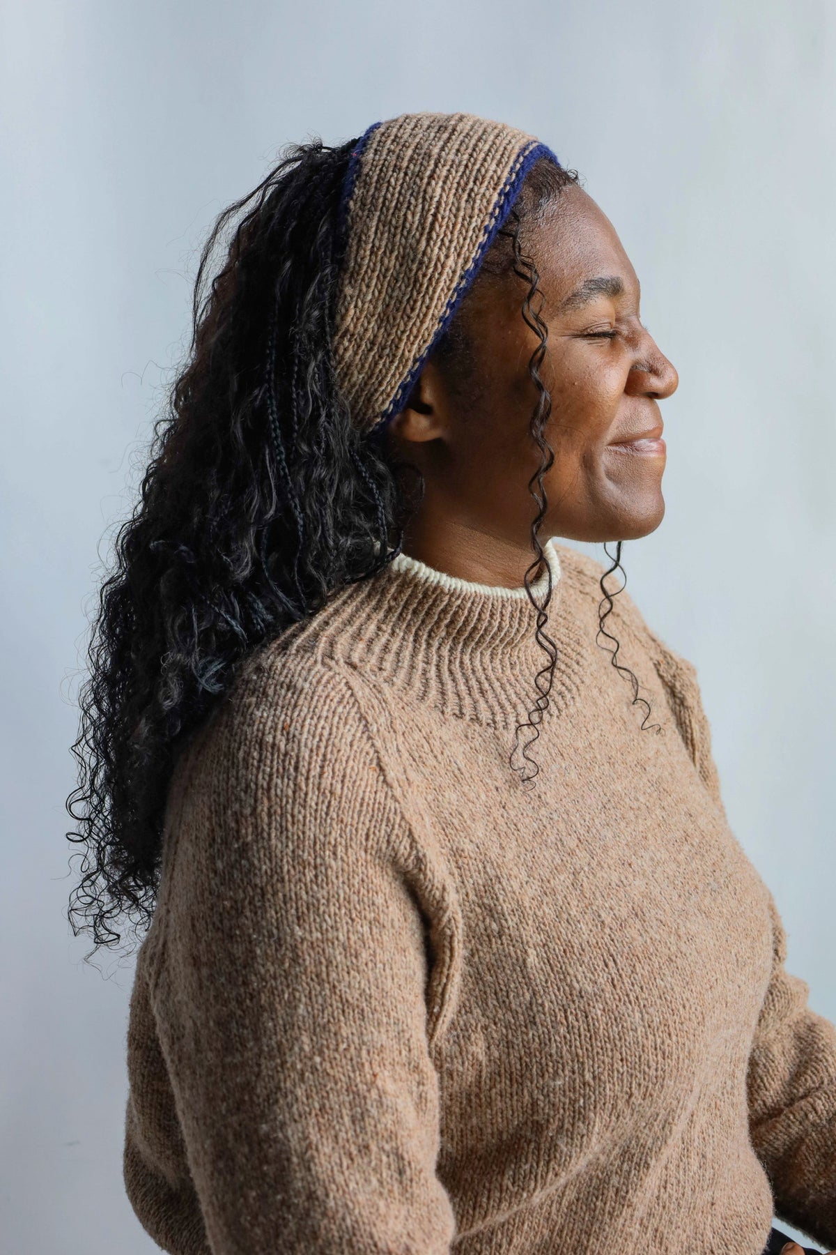 Model wearing Utku Knit Headband in Tobacco Brown