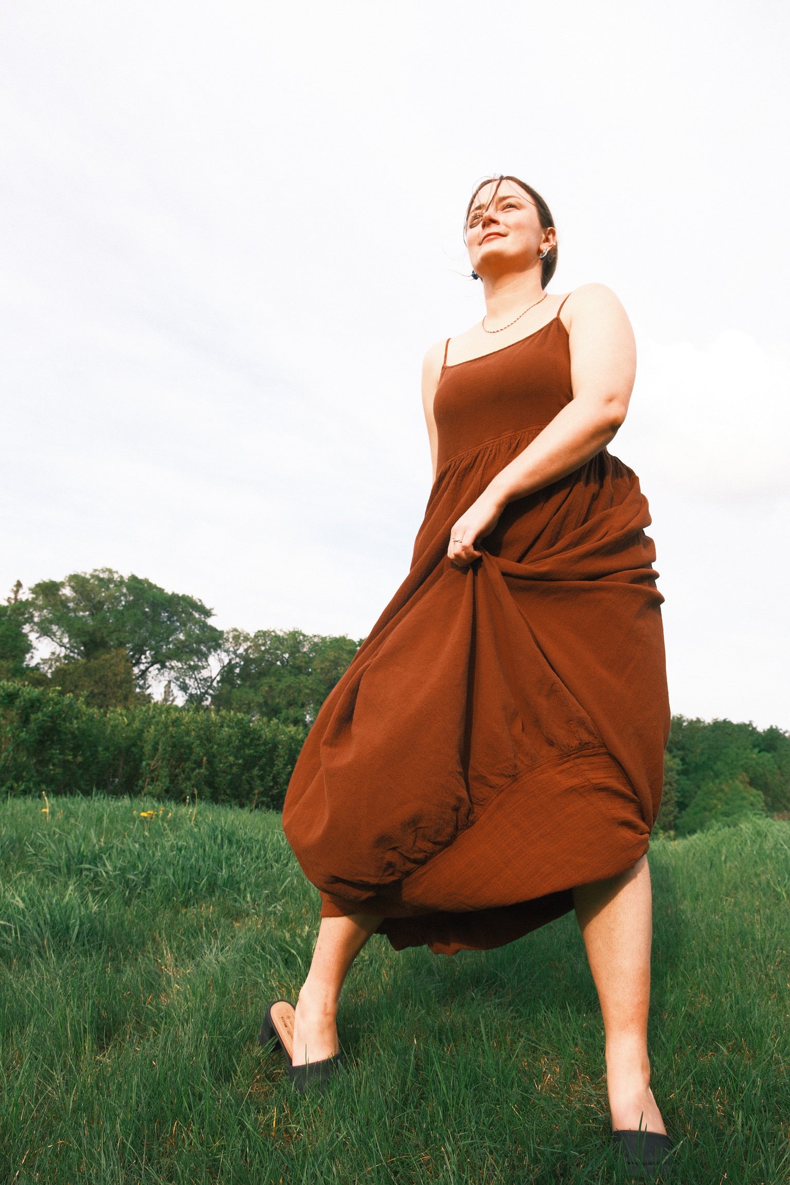 Model wearing Utku Barrel Dress in Espresso — crinkle cotton
