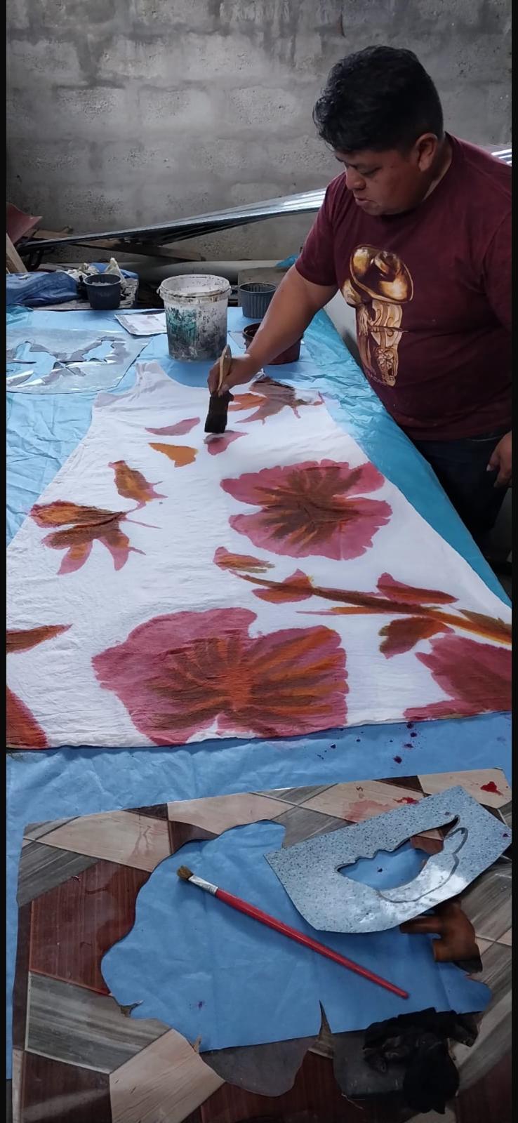 Close-up of the hand-painting process on UTKU's Hand Painted Floral Dress